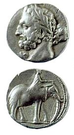 Monnaie punique d'Espagne avec un Hercule-Melqart à l'avers et un éléphant de guerre avec son cornac au revers