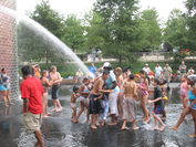 The fountain spouting water on frolicking children