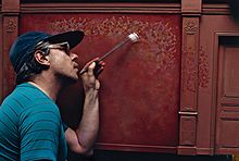 Charles Matton painting a red wall.jpg