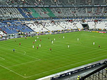 Photographie prise depuis les tribunes du Stade de France, montrant le match Rennes - Bordeaux.