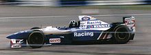 Photo de Damon Hill au Grand Prix de Grande-Bretagne 1995. Il abandonne au trentième tour du Grand Prix du Brésil 1995 suite à un problème de boite de vitesse