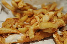 Fish and chips wrapped in paper.