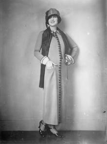 Norma Shearer in long coat.png