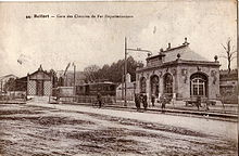 Carte postale ancienne montrant la gare de Belfort du Chemin de fer d'intérêt local, avec une motrice au départ