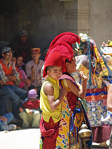 Young buddhist monk in ceremonial headwear.jpg