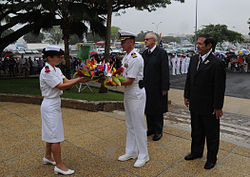 US Navy 090925-N-8721D-037 Capt. Thom Burke, commanding officer of the amphibious command ship USS Blue Ridge (LCC 19) receives a wreath to lay at the U.S. war memorial during a ceremony.jpg