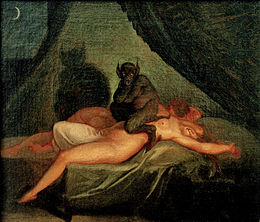Tableau représentant un démon de couleur noire, poilu, aux yeux rouges, oreilles pointues dressées et queue, assis à califourchon sur le ventre d'une femme nue et endormie, étendue sur le dos sur son lit, contre un deuxième corps.