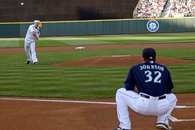 US Navy 090724-N-2143T-002 Hull Technician 1st Class John Parkin, from Des Moines, Iowa, throws the opening pitch to Seattle Mariners catcher Rob Johnson during Seattle Mariners Military Appreciation Night.jpg