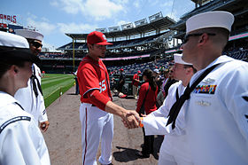 US Navy 110515-N-AD372-105 Washington Nationals pitcher Cole Kimball takes a moment to congratulate the 2010 Sailors of the Year before being honor.jpg