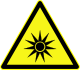 Avertissement sur les rayons lumineux, symbole D-W009 introduit par la norme allemande DIN 4844-2